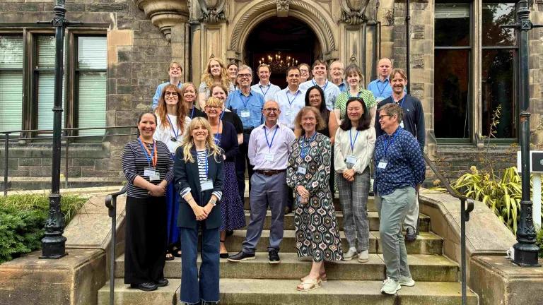 ENERGISE Team members standing outside of the entrance to St Leonard's Hall, Edinburgh