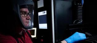 Researcher with a protective helmet working