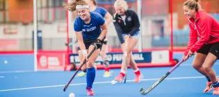 Students playing hockey at pefermill pitches