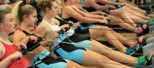 student practicing on rowing machines and the pleasance sport centre