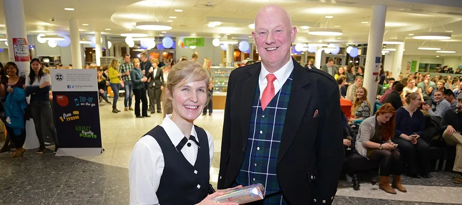 Student piper, Laura Bond and Dr Geoff Pearson