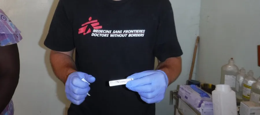 Ed Tulloch with the gloves he took out with him on his elective.