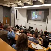 Photo showing a lecture theatre with an audience and presenters during Extreme Imagination Conference 2019