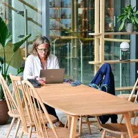 Person on laptop in community space