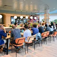 People eating in community space