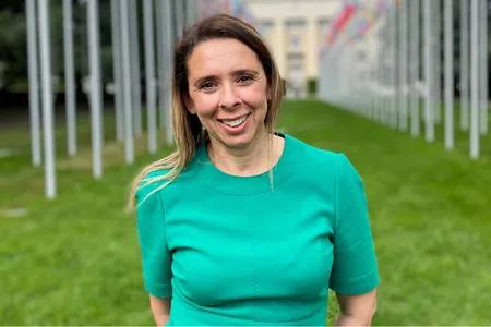 Mid shot of Aisha, smiling