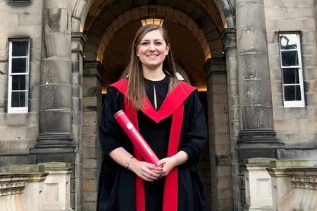 Kelsey in graduation robes