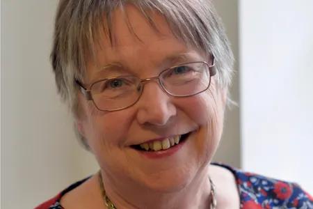 Close up portrait of Hilary, smiling