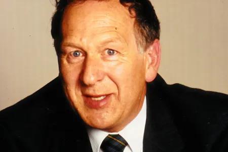 Head shot of Bill Miller wearing suit and tie