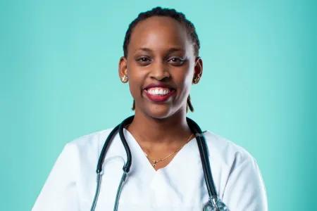 Head shot of Tania in doctor's scrubs