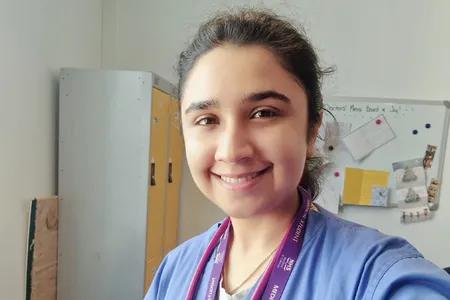 Head shot of Heen dressed in scrubs