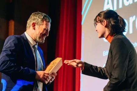 John receiving an award on stage