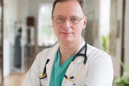 Portrait of Garry, wearing scrubs