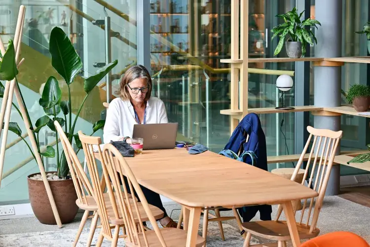 Person on laptop in community space