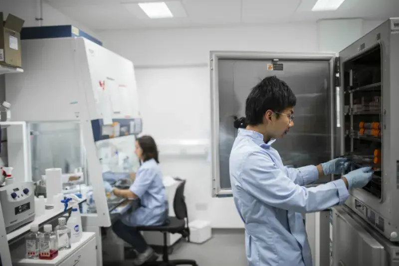 man and woman working in lab