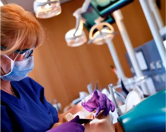 person wearing mask and working