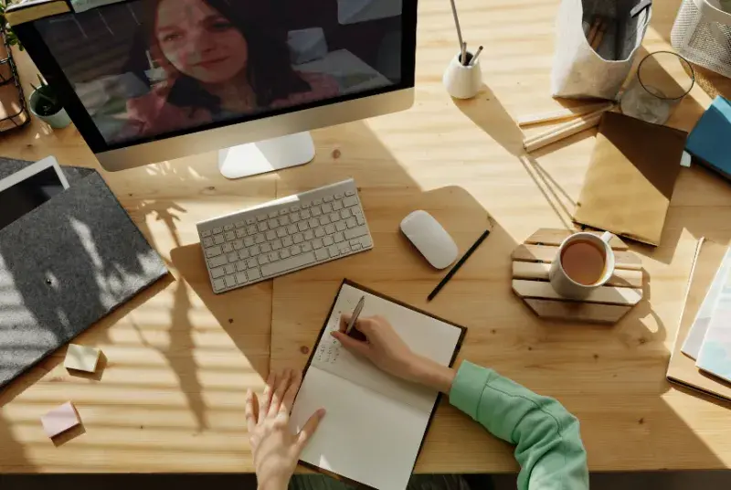 Woman at desk studying online