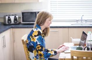 online student sat at home working