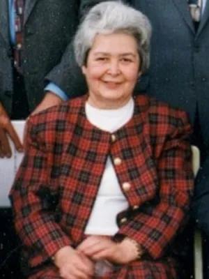 Archive image of Isabel seated, smiling