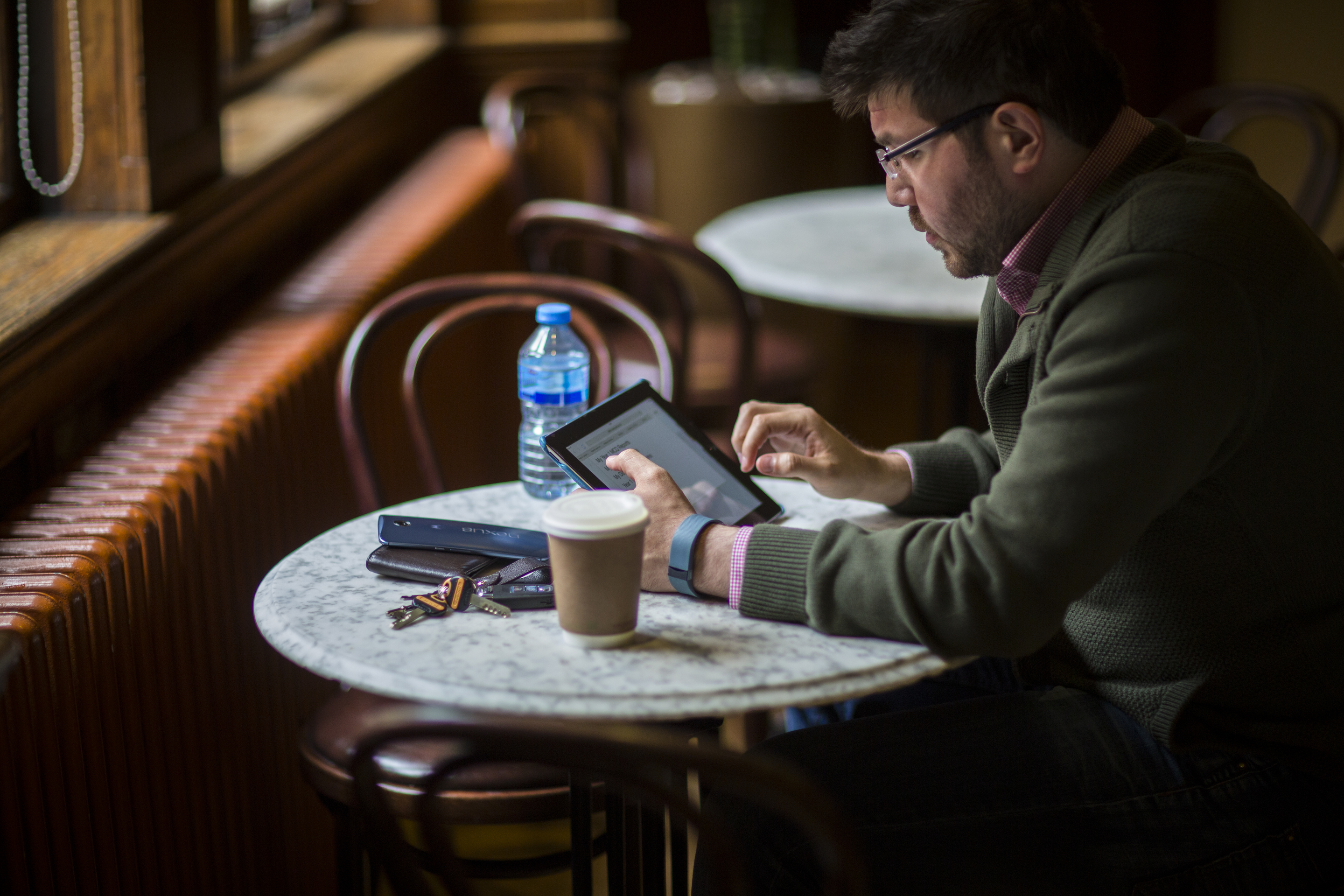 man studying online degree at laptop