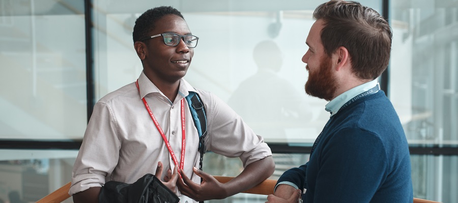 staff and student chatting